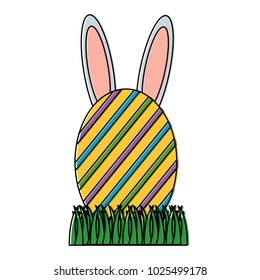 easter egg with rabbit ears on grass