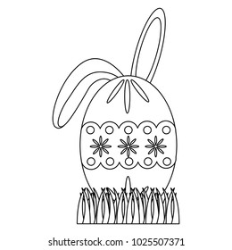 easter egg with rabbit ears on grass