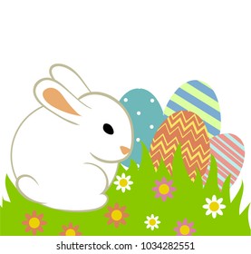 Easter eggs and bunny in grass isolated on white.