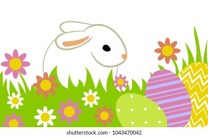 Easter eggs and bunny in grass isolated on white.