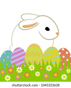 Easter eggs and bunny in grass isolated on white.