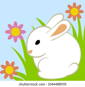Easter eggs and bunny in grass on blue background