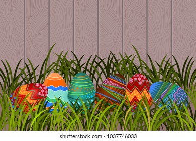 easter eggs in clump of grass near paling.  Vector design card. 