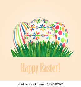 Easter eggs with colorful patterns and green spring grass