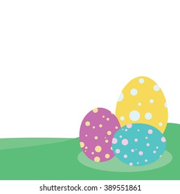 Easter eggs with colorful polka dots. On the green grass White background
