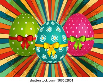 Easter Eggs Decorated with Ribbons and Bow Over Retro Starburst Background