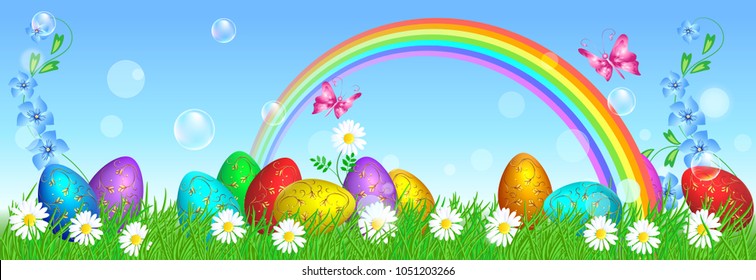 Easter eggs with decorative golden ornament stand on green grass against blue sky and rainbow