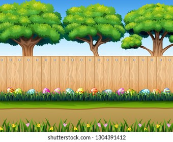 Easter eggs decorative on the grass with wooden fence