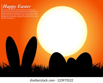 Easter eggs and ears rabbit in silhouette in front of a sunset
