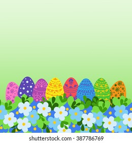 Easter eggs and flowers. Colorful Easter background.