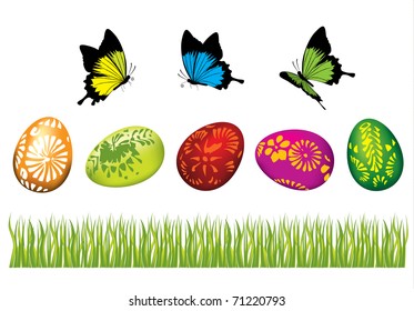 Easter eggs in the grass with butterflies