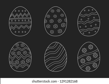 Easter eggs hand drawn white on black background. printing on fabric,gift wrap and wallpapers. 