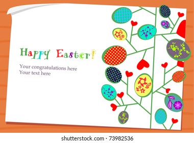 Easter eggs -leaves on paper card wooden background