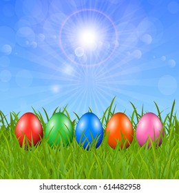 Easter eggs on the grass under the sky for stock