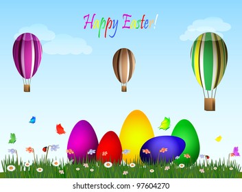 Easter eggs on a green field with hot air eggs balloons on blue sky.