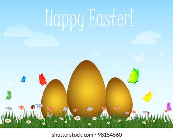 Easter eggs on a green field on blue sky