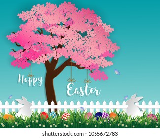 Easter eggs on green grass in the garden with white rabbits,little daisy and butterfly under sakura tree on soft blue background,paper art and digital craft style,vector illustration