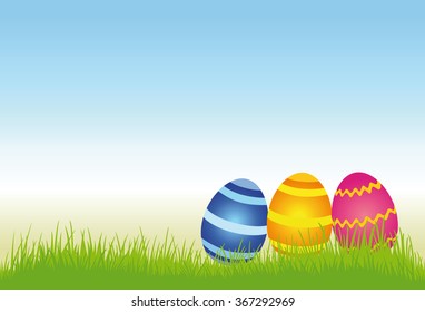 Easter eggs on a meadow