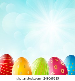 Easter eggs on sunny background