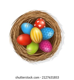 Easter eggs on wild bird nest from straw and twigs