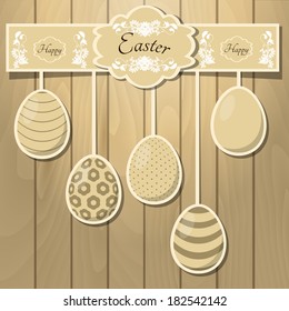 Easter eggs on the wooden background