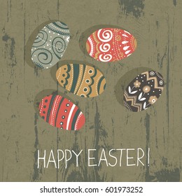 Easter eggs on wooden board.  Happy Easter greetings card 