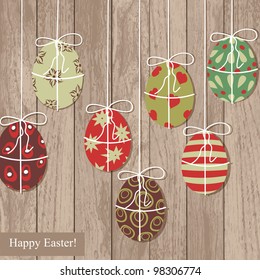  Easter eggs on wooden texture.