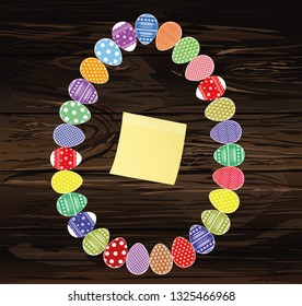 Easter eggs with a pattern in the shape of an oval.  Empty Yellow sheet of paper for notes. Sticker. Greeting card for the holiday. Free space for text. Vector on wooden background
