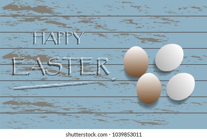 Easter eggs are placed on old wooden floor. The text is said Happy Easter. Suitable to be used for invitation cards. Labels, posters and print media.