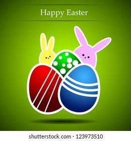 Easter eggs and rabbit on a green background