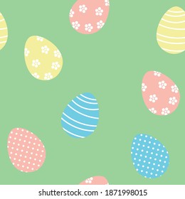 Easter eggs seamless vector pattern on a green background.
