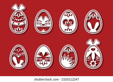 Easter eggs set. White abstract ornamental flower eggs for laser cutting on red background. Icons for greeting card