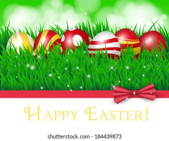Easter eggs. Spring card with colored Easter eggs, fresh green grass and green bokeh background.Red bow, white card and lights.