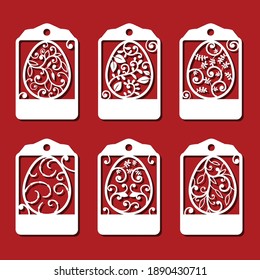 Easter eggs Tag set. White ornamental eggs for laser cutting on red background. Icons for greeting card