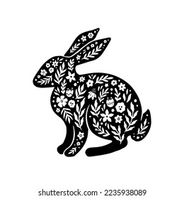 Easter floral rabbit silhouette in linocut style. Cute bunny shape, flower, leaves. Vector folk art illustration isolated on white background. Bloom linocut rabbit icon for logo, social media, print.