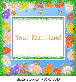 Easter frame with eggs in a grass