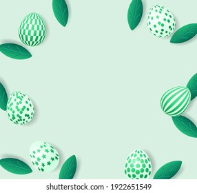 Easter frame with easter eggs and green leaves. Easter decorative composition
