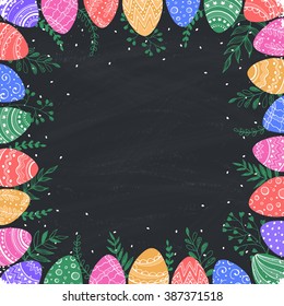 Easter frame with easter eggs hand drawn on chalkboard. Decorative frame from eggs with copy space. Easter illustration with colorful Easter eggs and leaves. 