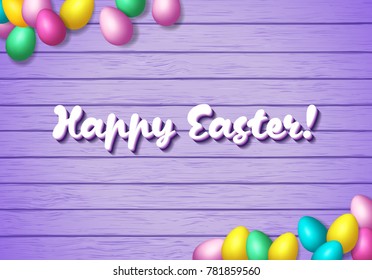 Easter frame with shiny colorful eggs spread over wooden background