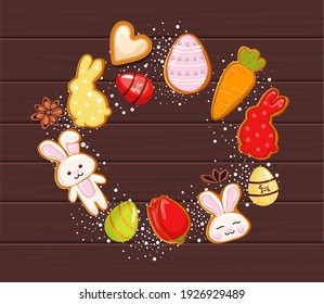 Cookies de pain d'épices de Pâques en cercle, fêtes de Pâques, oeufs colorés. Sur fond bois. image