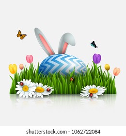 Easter greeting card with bunny ears and egg in the grass on white background