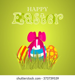 Easter greeting card. Easter colored eggs with a bow.