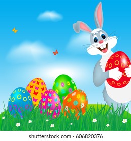 Easter greeting card with colorful eggs and bunny.