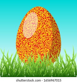 Easter greeting card. Colorful pattern egg in the green grass vector holiday illustration.