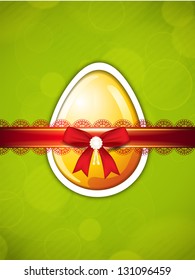 Tarjeta de saludo de Pascua con huevo y cinta.