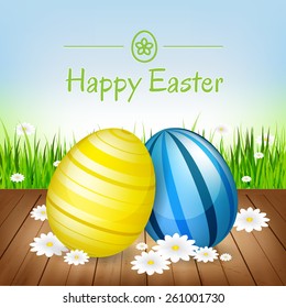 Easter greeting card. Easter eggs, flowers and green grass/vector illustration