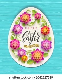 Easter greeting card - egg-shaped paper banner with floral frame and calligraphic greeting on a wooden background. Vector illustration.