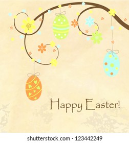 Easter greeting card with hanging eggs on the branch