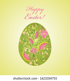Tarjeta de saludo de Pascua con huevo verde pintado con adorno floral decorativo