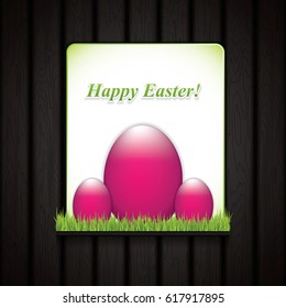 Easter greeting card with pink eggs on grass